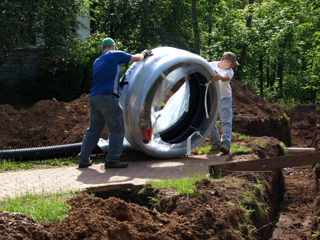 Pre-insulated Uponor PEX underground installation image featuring 2 commercial contractors